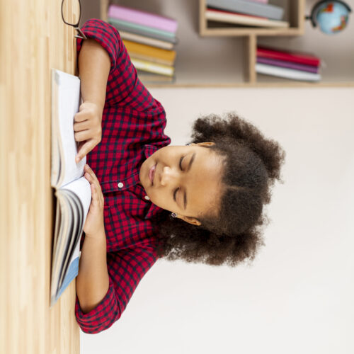 front-view-little-girl-reading